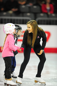 Paige Lawrence and a CanSkate student.